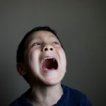 boy opening mouth