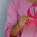 woman in pink and white polka dot shirt
