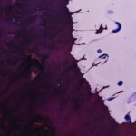 Dynamic abstract artwork using vibrant acrylic paint fluid techniques.