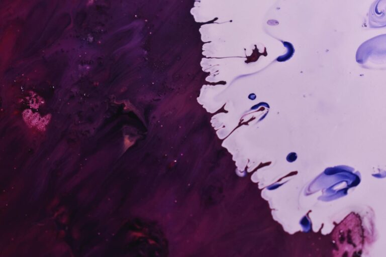 Dynamic abstract artwork using vibrant acrylic paint fluid techniques.