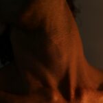 a close up of a man with no shirt on