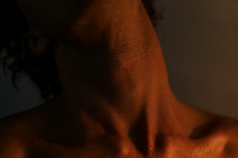 a close up of a man with no shirt on