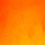 a close up of a fire with water drops on it